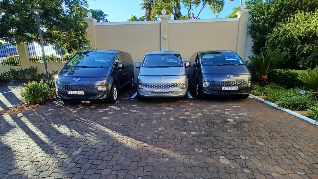 Three Hyundai Staria people carriers from the Foreverlit fleet parked in a Johannesburg driveway